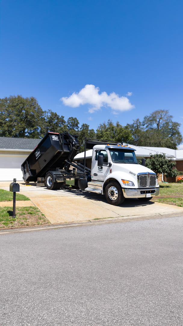 Dumpster delivery on residential driveway